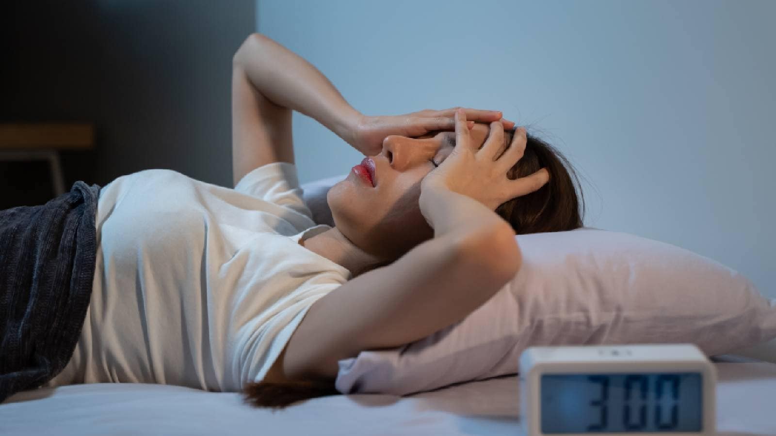A woman waking up at night