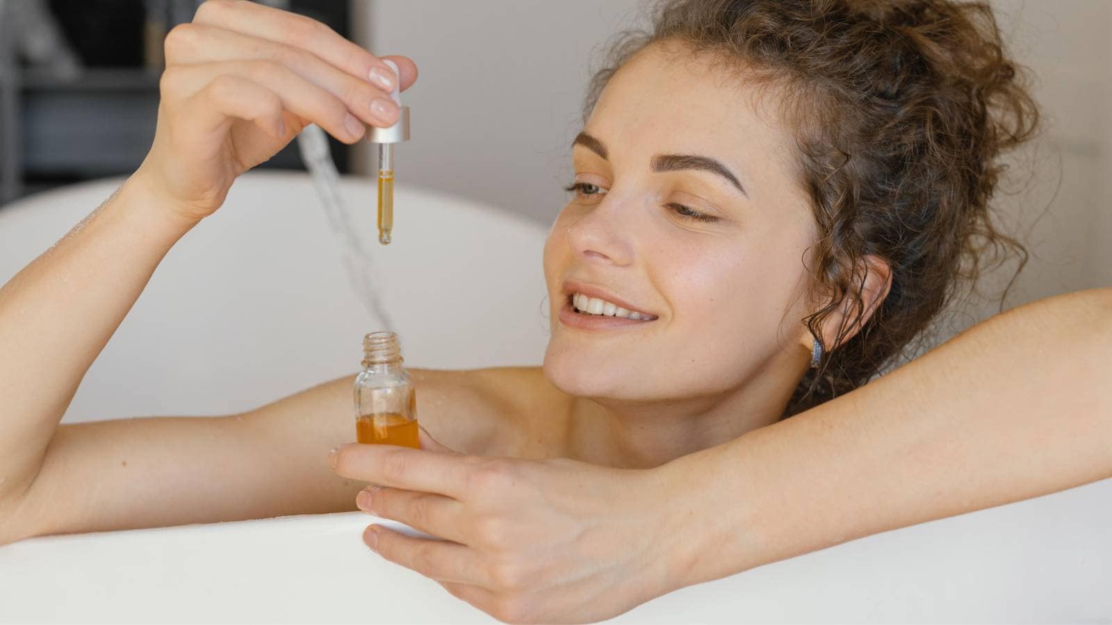 A woman with an oil bottle