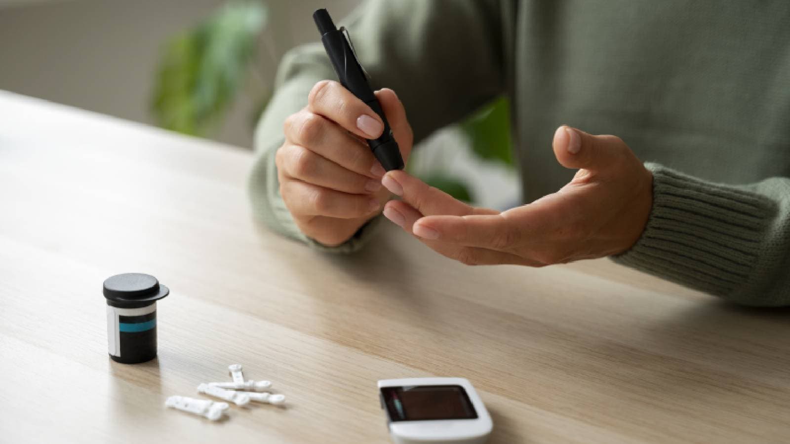 A woman checking her blood sugar