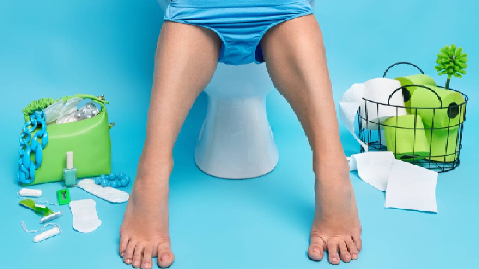 A woman sitting on the toilet seat