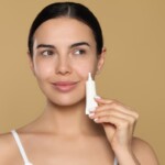 woman holding a skincare cream