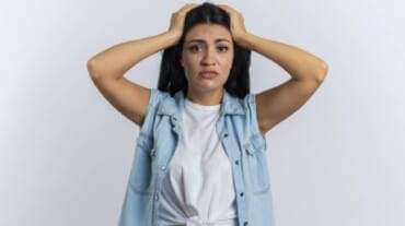 A woman worried about face fat.