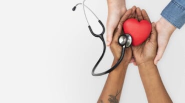 Two hands holding a heart