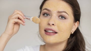 A woman using jaggery for skin