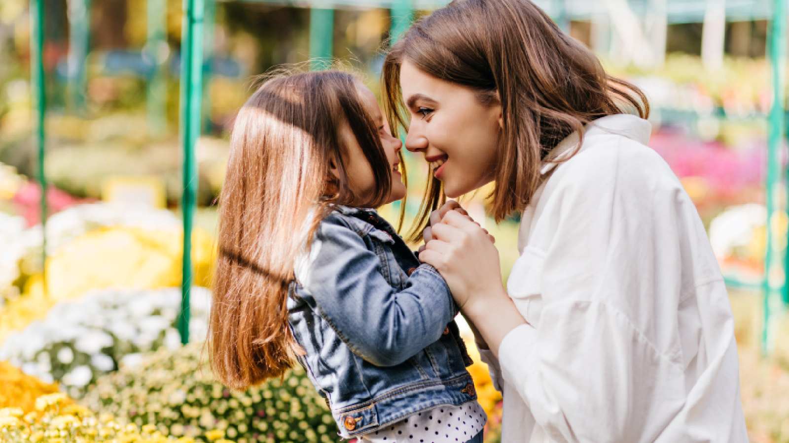 A woman playing with her daughter