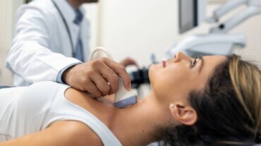 A woman getting thyroid checked