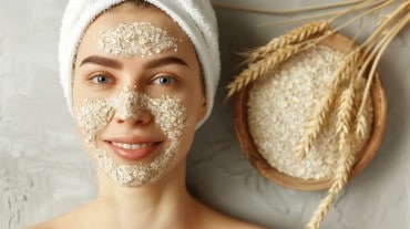Women applies oatmeal face mask