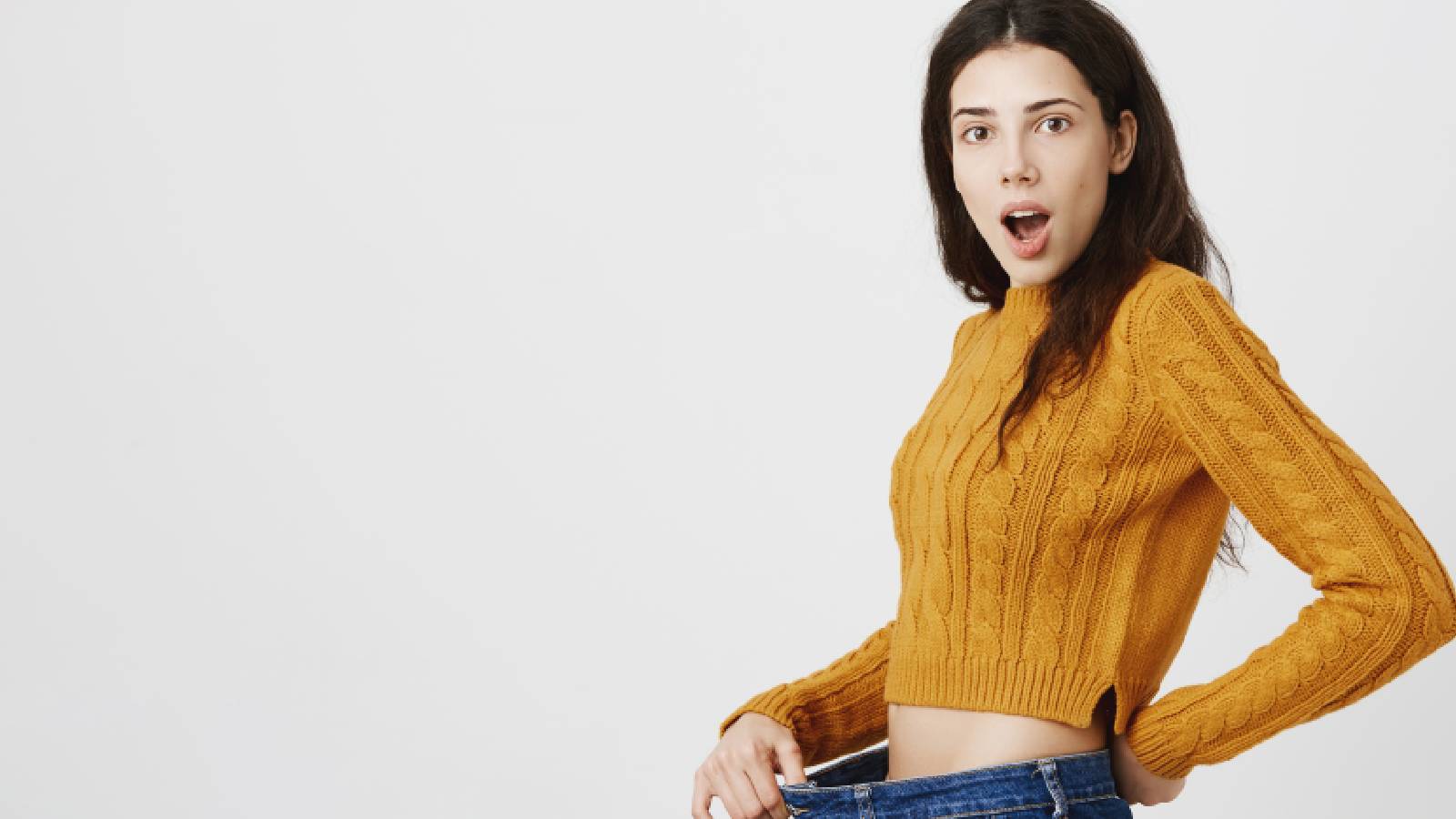 Woman flaunting her waistline after taking Ozempic