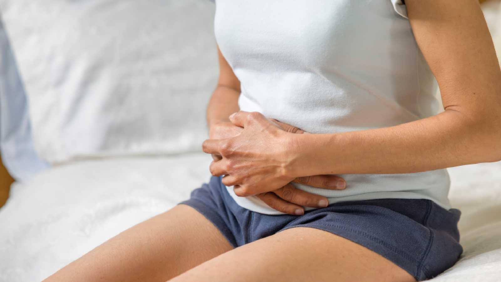 A woman experiencing period pain