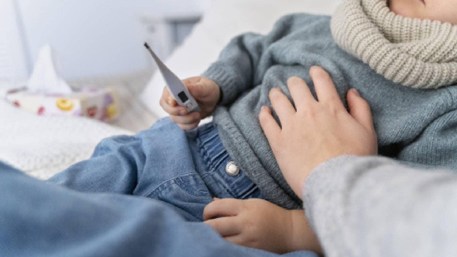 A baby with a thermometer