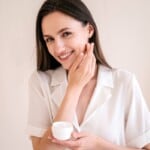 Woman applying cream